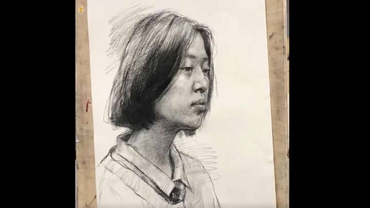 Drawing a portrait of girl in class